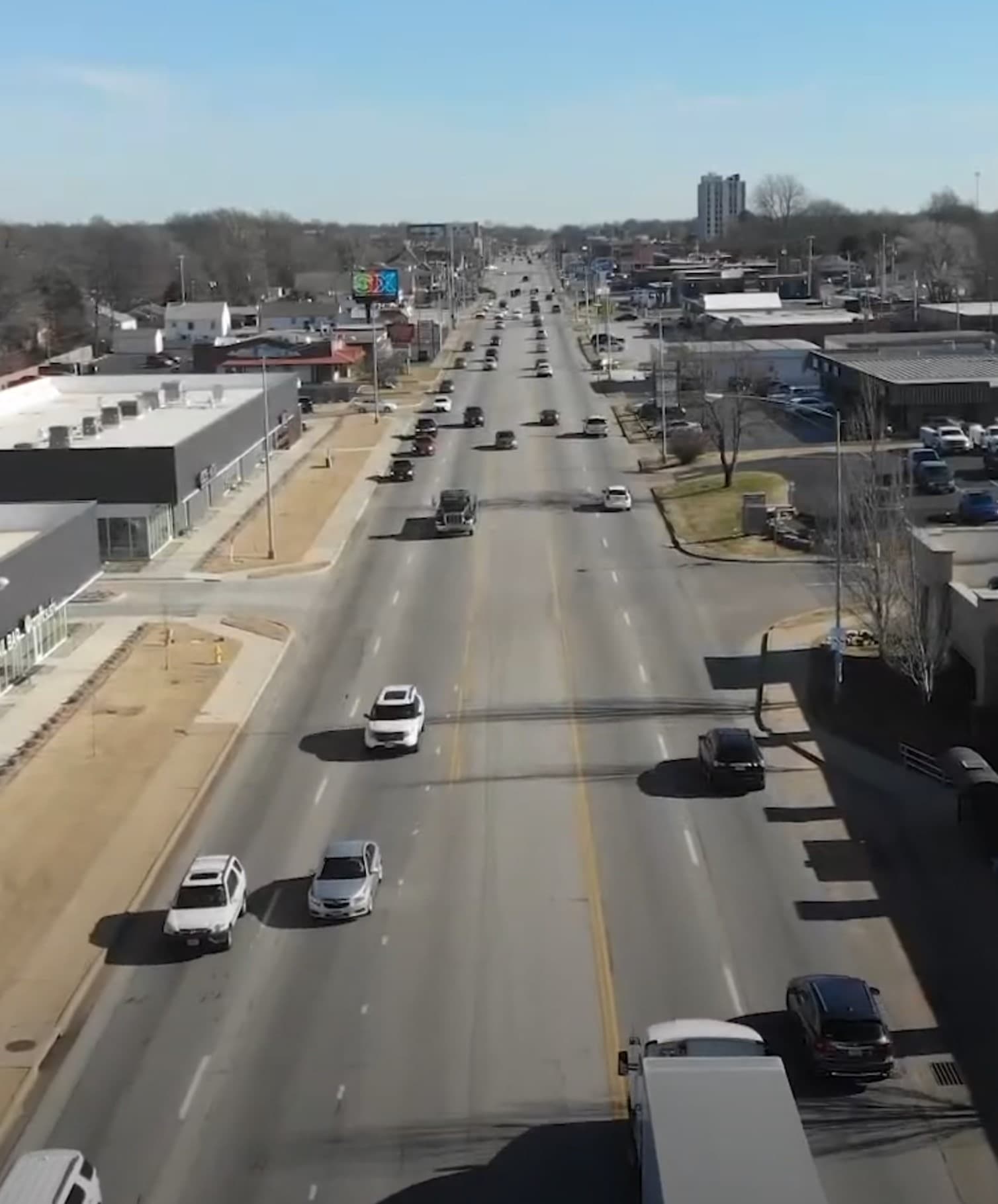 Busy arterial street with vehicle traffic.